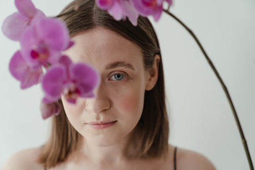 woman and pink orchids